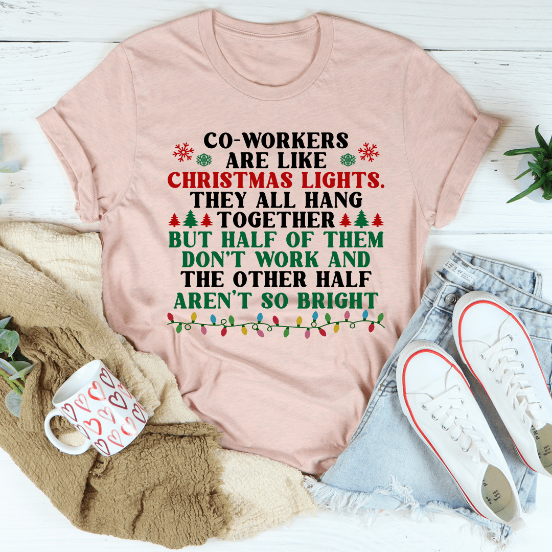 A festive t-shirt featuring the phrase 'Coworkers Are Like Christmas Lights' printed in colorful letters, made from soft cotton fabric.