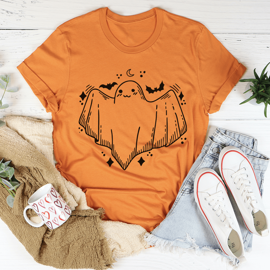 A cute little ghost graphic on a soft cotton t-shirt, showcasing its playful design and comfortable fit.