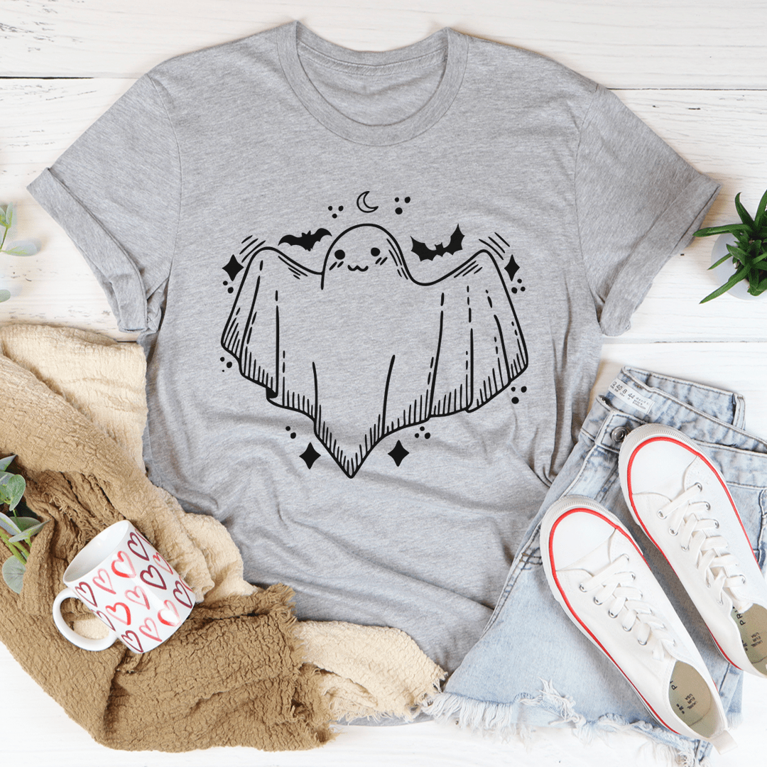 A cute little ghost graphic on a soft cotton t-shirt, showcasing its playful design and comfortable fit.