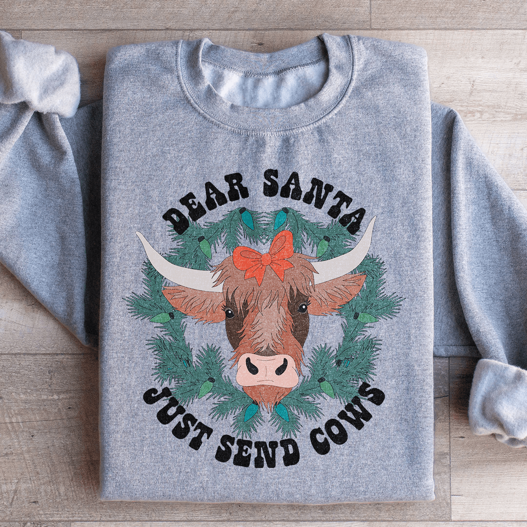 Cozy Dear Santa Just Send Cows sweatshirt featuring a playful design, perfect for casual wear.