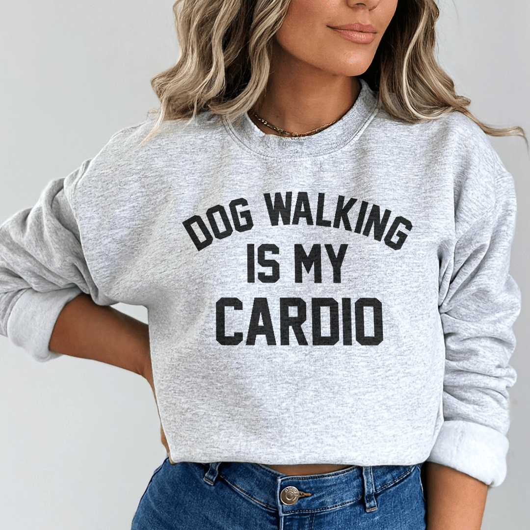 A stylish women performance tank top with 'Dog Walking Is My Cardio' printed, featuring a racer back design and curved hem.