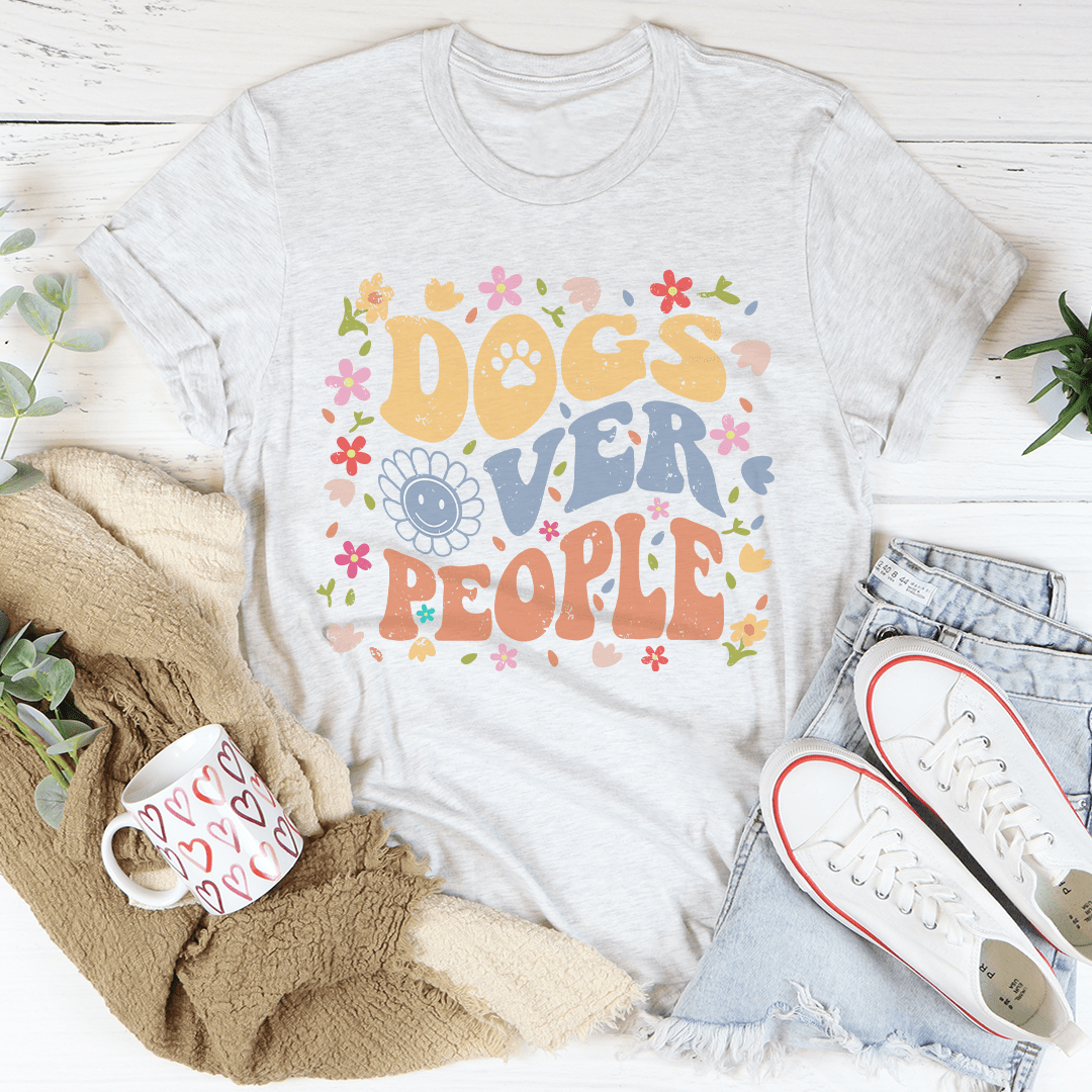 A comfortable Dogs Over People Tee made of soft cotton, featuring a stylish print that expresses love for dogs.