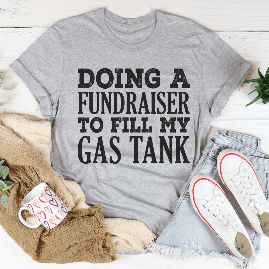 A comfortable Doing A Fundraiser To Fill My Tank Tee made from soft ring-spun cotton, featuring double stitching for durability.