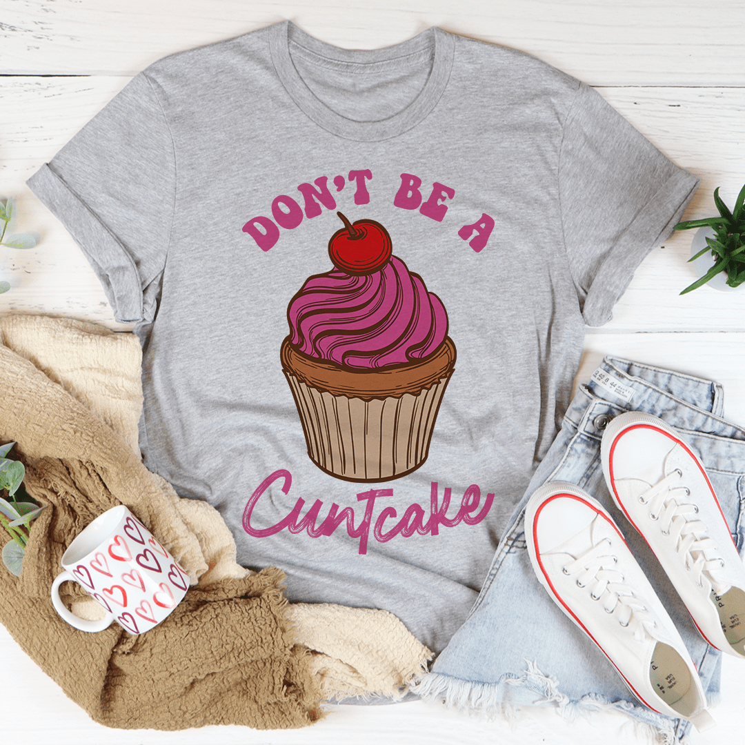 A stylish Don't Be A Cuntcake Tee made from soft ring-spun cotton, featuring a humorous design and durable double stitching.