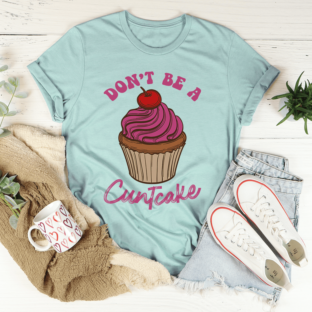 A stylish Don't Be A Cuntcake Tee made from soft ring-spun cotton, featuring a humorous design and durable double stitching.