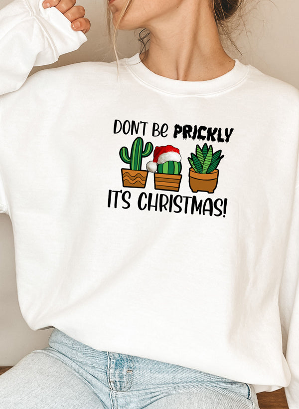 A cozy Don't Be Prickly It's Christmas Sweat Shirt featuring a festive design, made from a soft cotton/poly fleece blend.