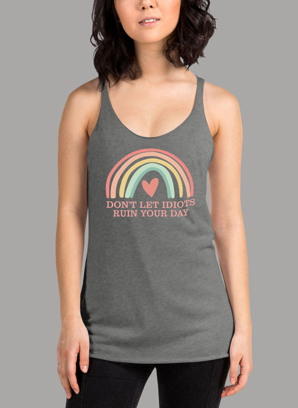 A stylish women's tank top featuring a racer back design with the phrase 'Don't Let Idiots Ruin Your Day' printed on it, showcasing a comfortable fit.