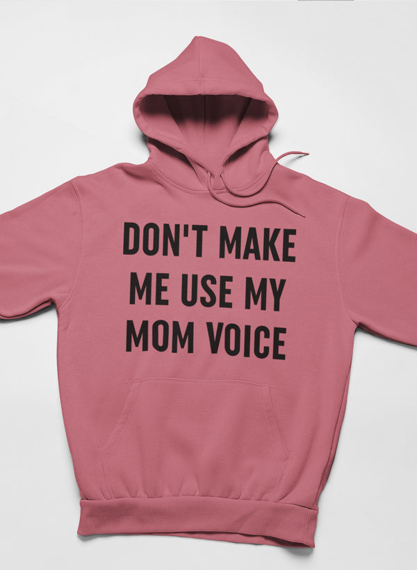 A cozy hoodie featuring the phrase 'Don't Make Me Use My Mom Voice' designed by top artists, showcasing a stylish and comfortable fit.