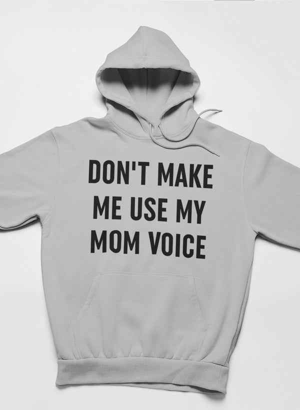 A cozy hoodie featuring the phrase 'Don't Make Me Use My Mom Voice' designed by top artists, showcasing a stylish and comfortable fit.