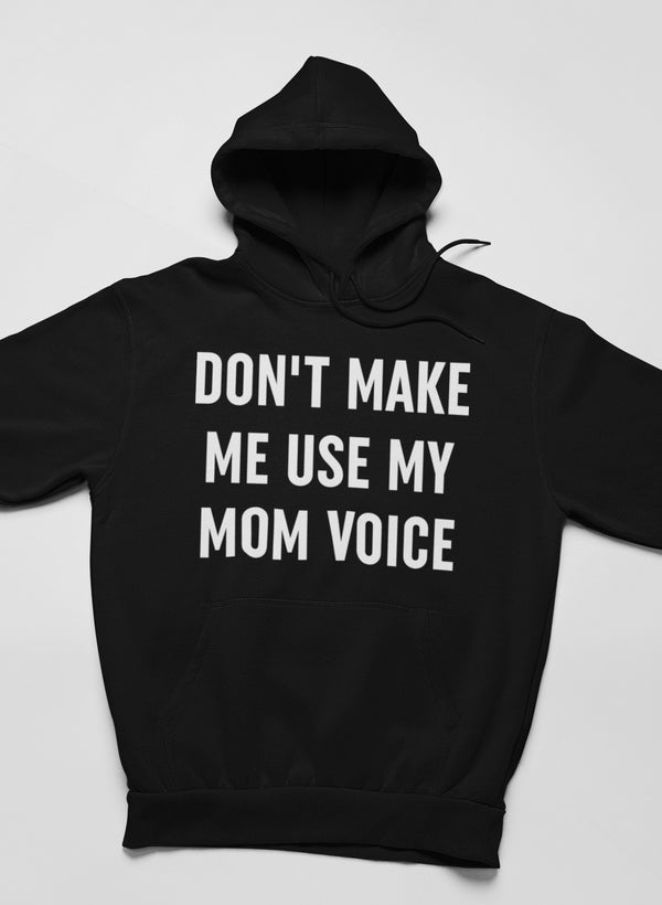 A cozy hoodie featuring the phrase 'Don't Make Me Use My Mom Voice' designed by top artists, showcasing a stylish and comfortable fit.