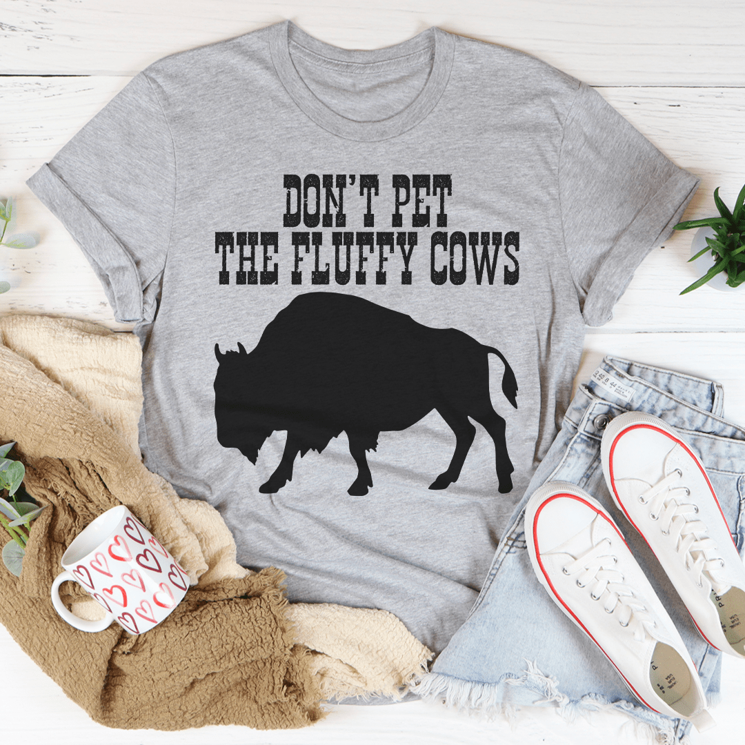 A comfortable Don't Pet The Fluffy Cows T-Shirt made from soft cotton, featuring a fun design and durable stitching.