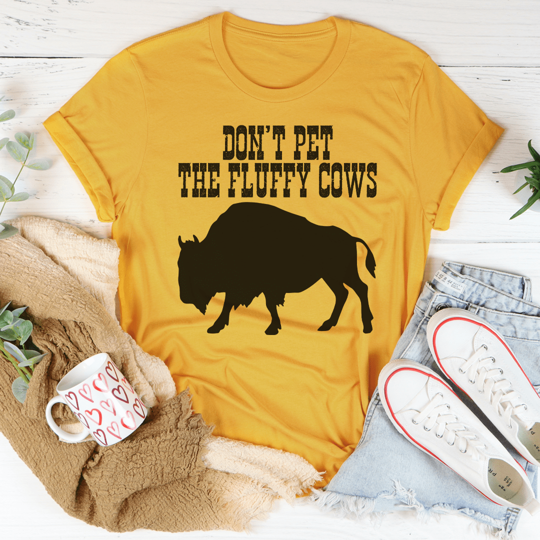 A comfortable Don't Pet The Fluffy Cows T-Shirt made from soft cotton, featuring a fun design and durable stitching.