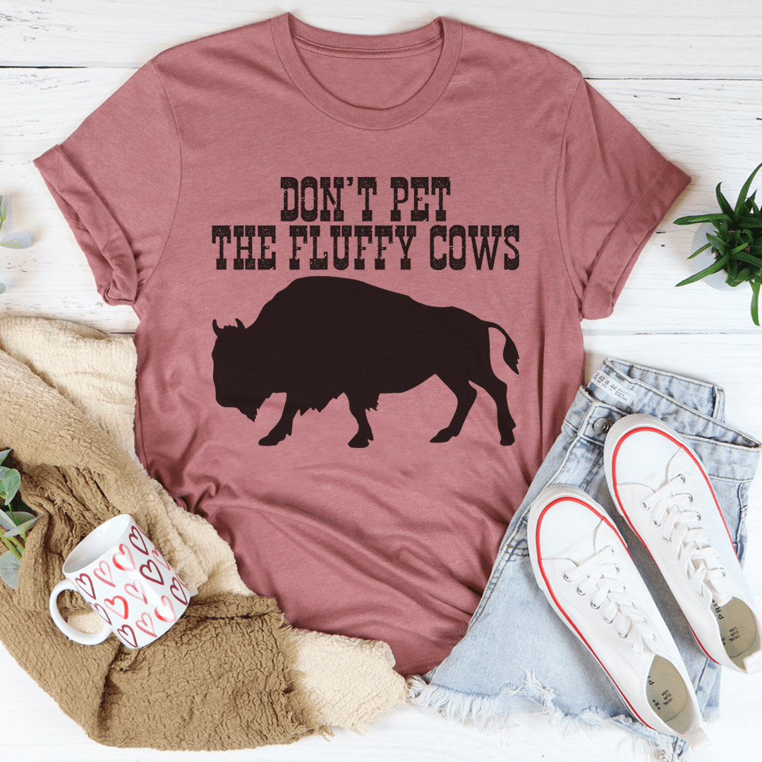 A comfortable Don't Pet The Fluffy Cows T-Shirt made from soft cotton, featuring a fun design and durable stitching.