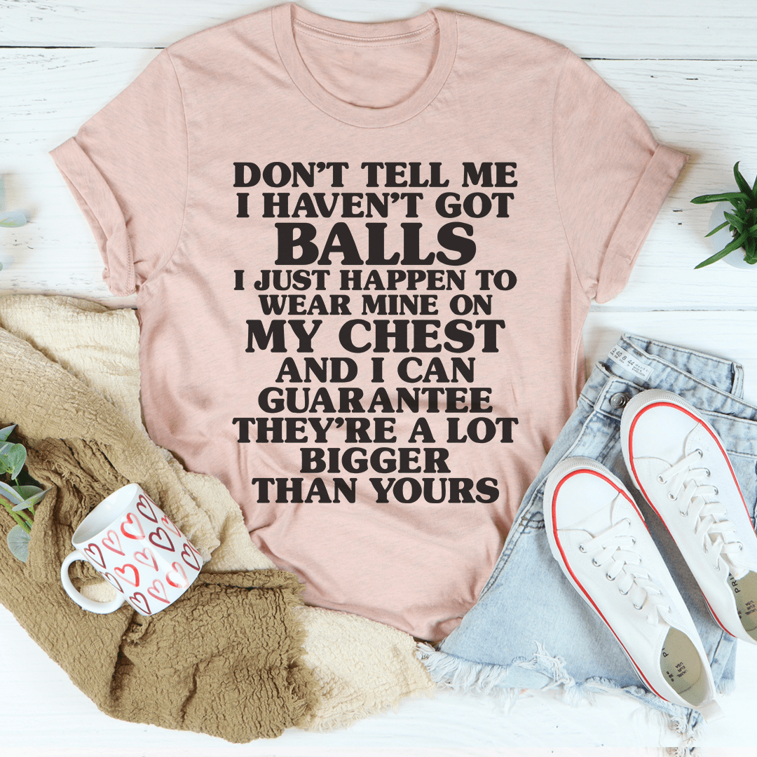 A stylish Don't Tell Me I Haven't Got Balls T-Shirt made from soft ring-spun cotton, featuring a bold statement print.