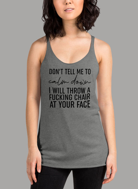 Black women tank top with 'Don't Tell Me To Calm Down' text, racer back style, and curved back hem.