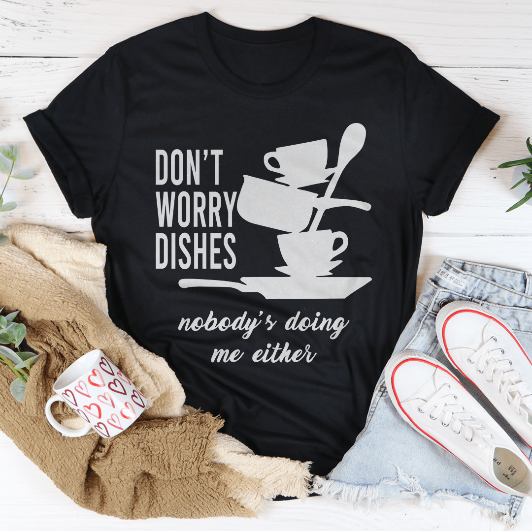 A comfortable Don't Worry Dishes Nobody's Doing Me Either Tee made from soft ring-spun cotton, featuring a playful graphic design.