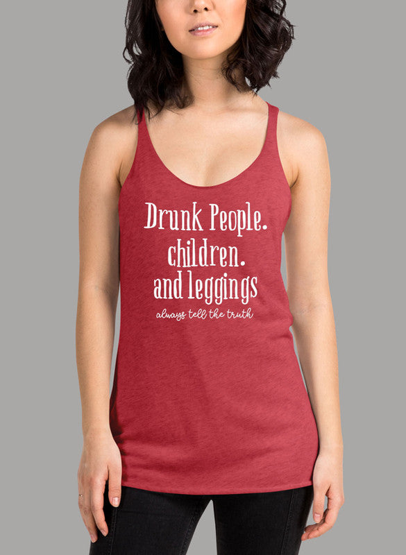 White women's tank top with racerback design and curved hem, featuring the text 'Drunk People Children And Leggings'.