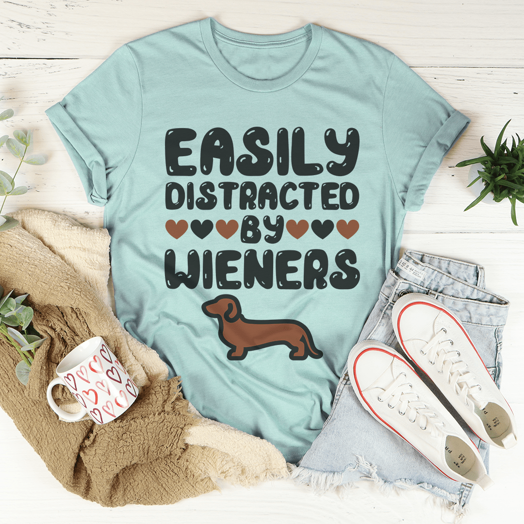 Easily Distracted By Wieners Tee featuring a playful design on a soft cotton fabric, perfect for casual wear.