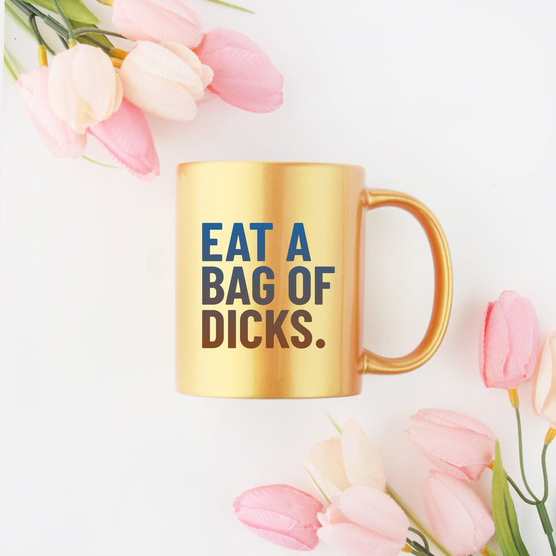 Ceramic Eat A Bag Of Dicks Gold & Silver Mug with a playful design and gold metallic coating.