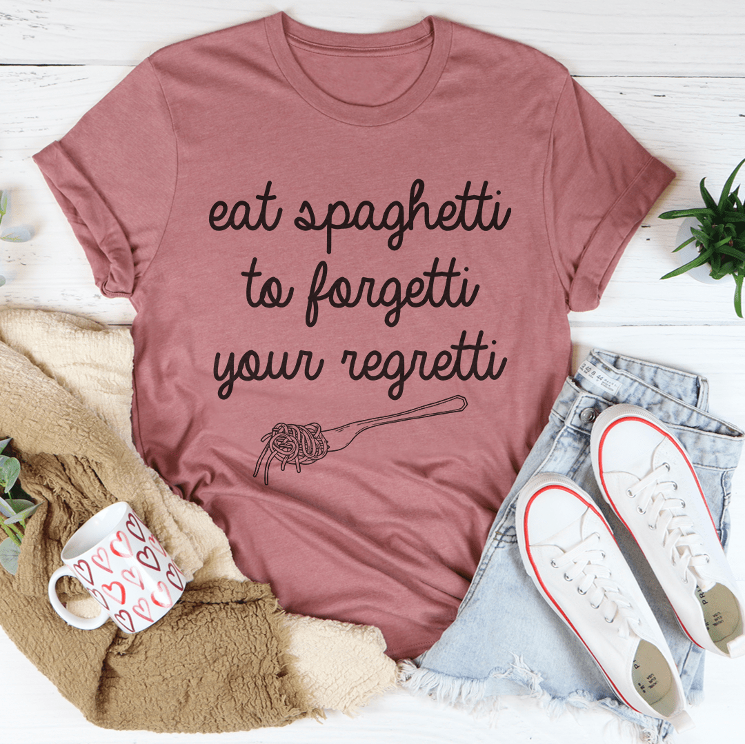 Eat Spaghetti To Forget Your Regretti T-Shirt displayed on a hanger, showcasing its soft cotton fabric and humorous design.