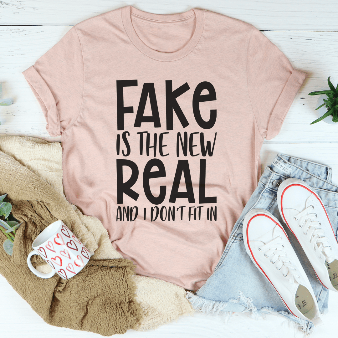 A stylish and comfortable Fake Is The New Real Tee made from soft ring-spun cotton, featuring double stitching for durability.