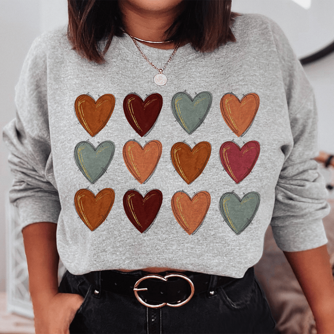 Fall Hearts sweats featuring cozy fleece lining and adjustable cuffs, designed by top artists.