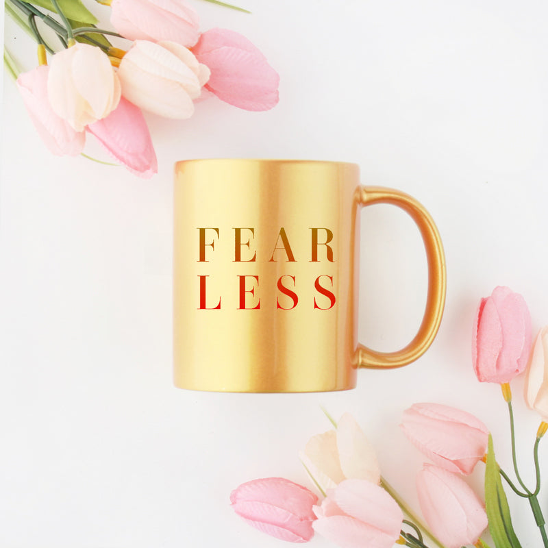 Fearless Gold & Silver Mug with elegant metallic design, ceramic material, and 11 oz capacity.