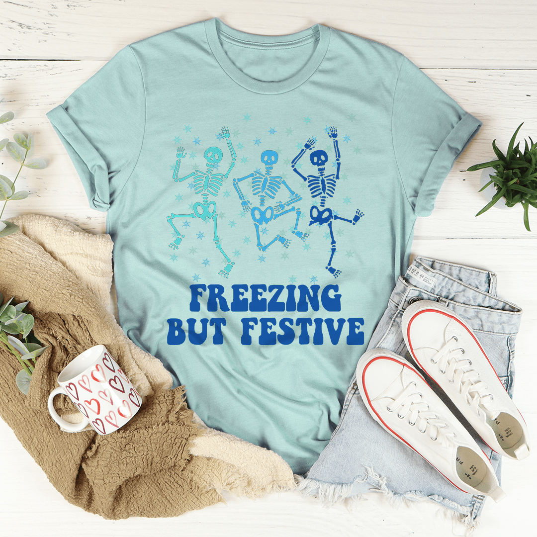 A cozy Freezing But Festive Tee made of soft ring-spun cotton, featuring double stitching for durability, displayed in a festive setting.