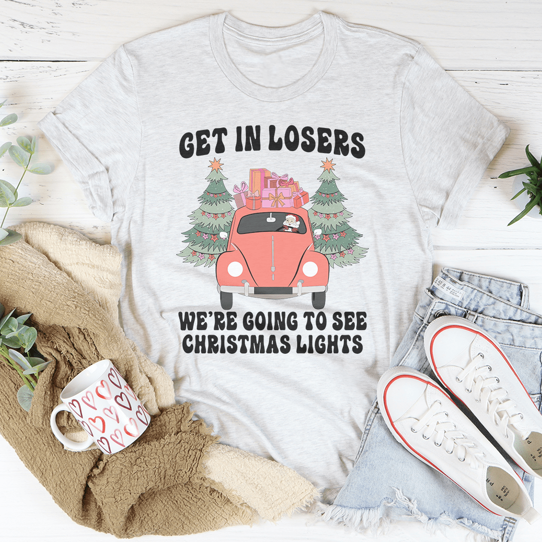 A festive t-shirt featuring the phrase 'Get In Losers We're Going To See Christmas Lights', made from soft cotton with double stitching.