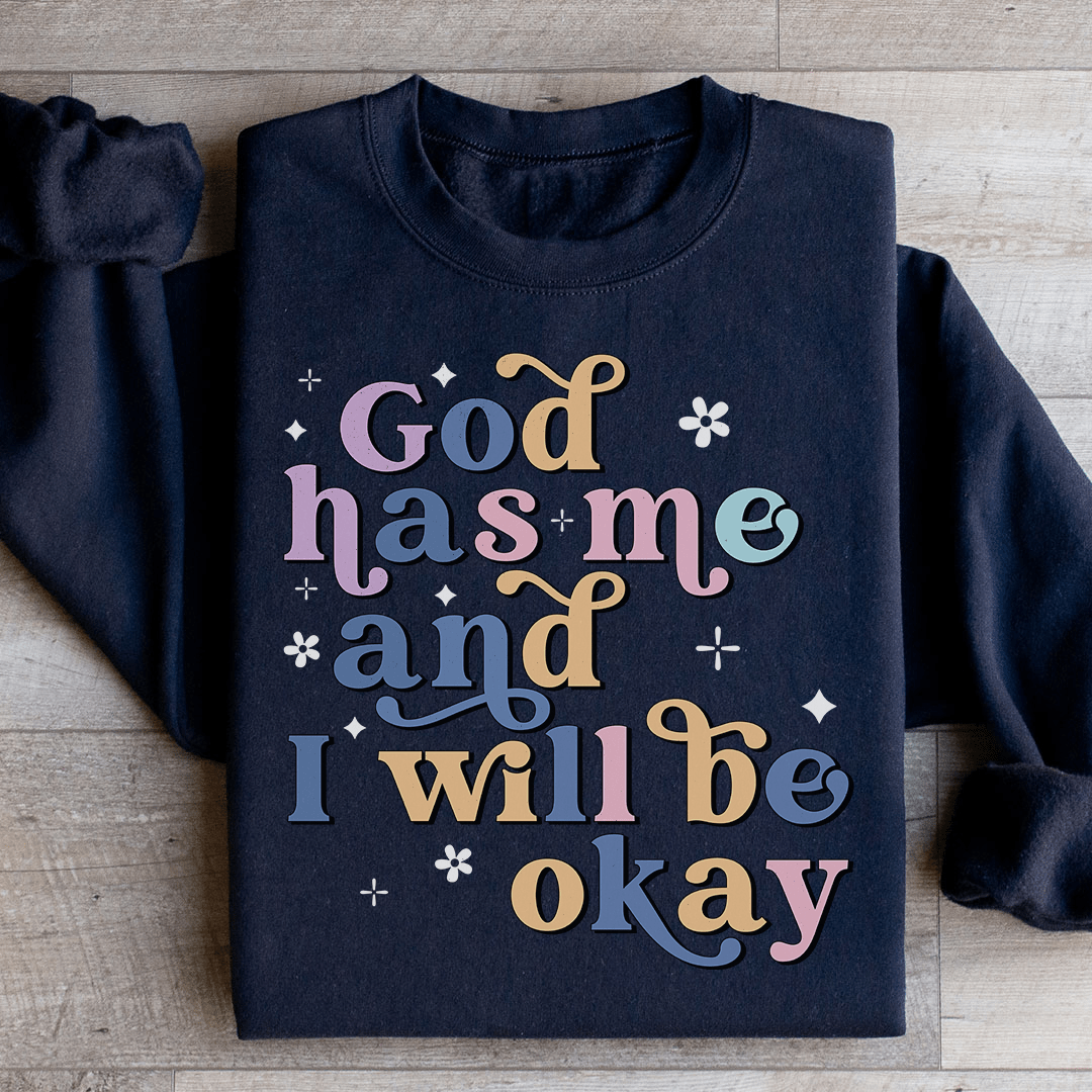 Cozy 'God Has Me And I Will Be Okay' sweats featuring a unique design by top artists, made from a warm cotton/poly fleece blend.