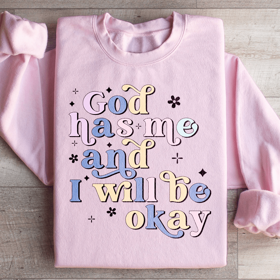 Cozy 'God Has Me And I Will Be Okay' sweats featuring a unique design by top artists, made from a warm cotton/poly fleece blend.