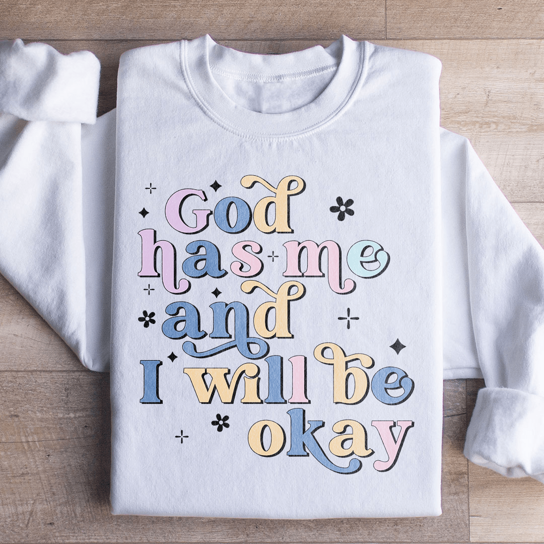 Cozy 'God Has Me And I Will Be Okay' sweats featuring a unique design by top artists, made from a warm cotton/poly fleece blend.