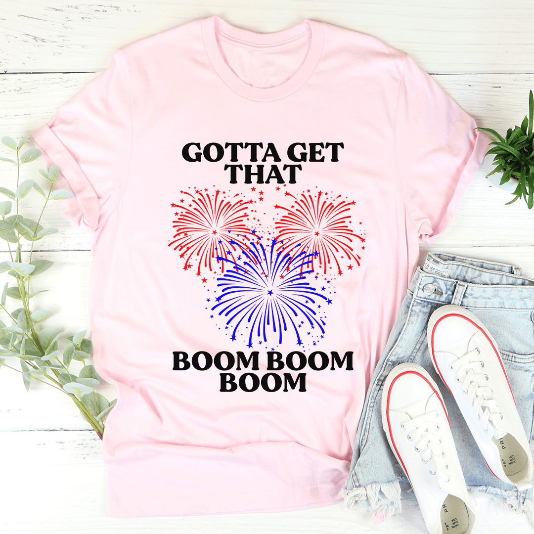 Gotta Get That Boom Boom Boom Tee in various colors, showcasing its soft fabric and double stitching details.