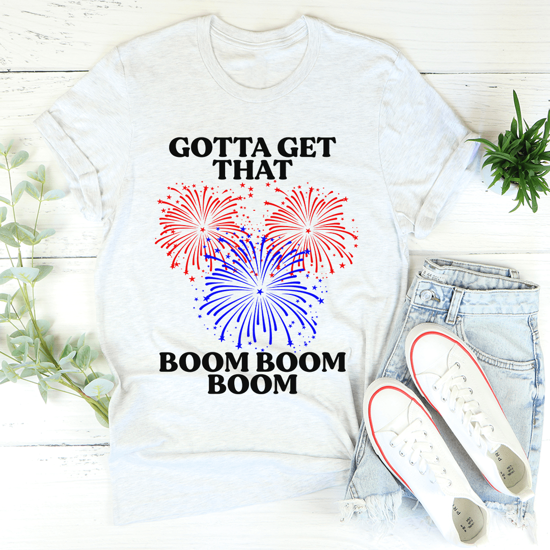 Gotta Get That Boom Boom Boom Tee in various colors, showcasing its soft fabric and double stitching details.