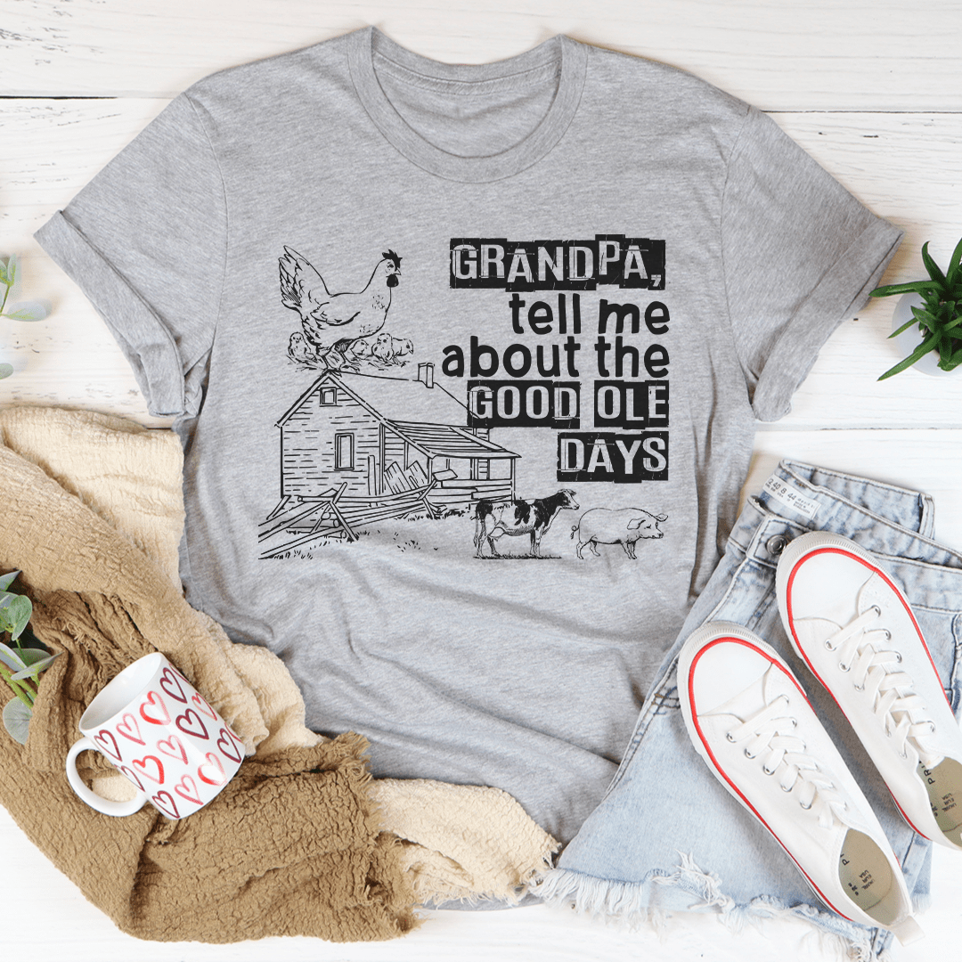 A comfortable and stylish t-shirt featuring the phrase 'Grandpa Tell Me About The Good Ole Days', made from soft ring-spun cotton.