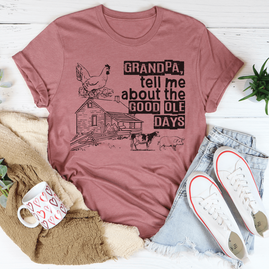 A comfortable and stylish t-shirt featuring the phrase 'Grandpa Tell Me About The Good Ole Days', made from soft ring-spun cotton.