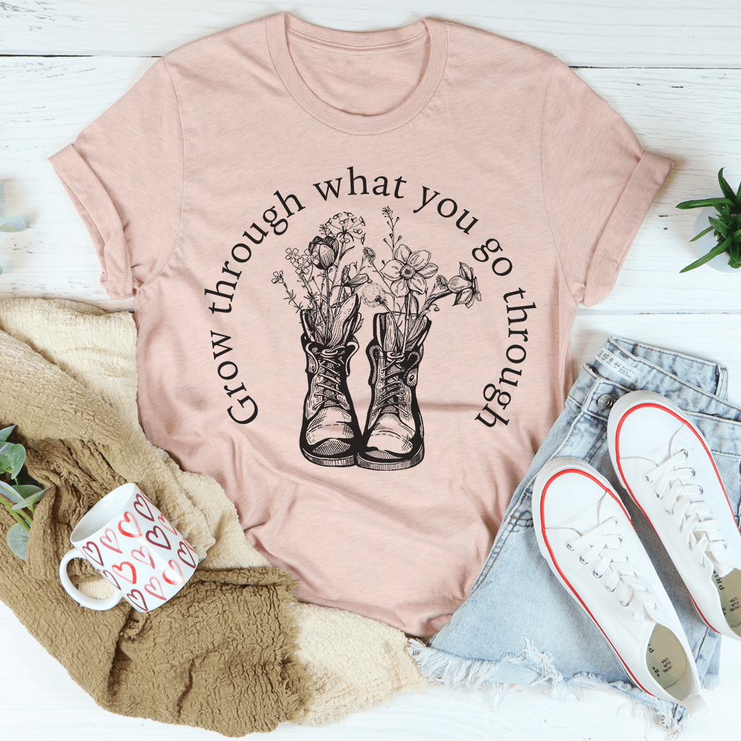 A stylish Grow Through What You Go Through Boots Tee made of soft ring-spun cotton, featuring double stitching for durability.