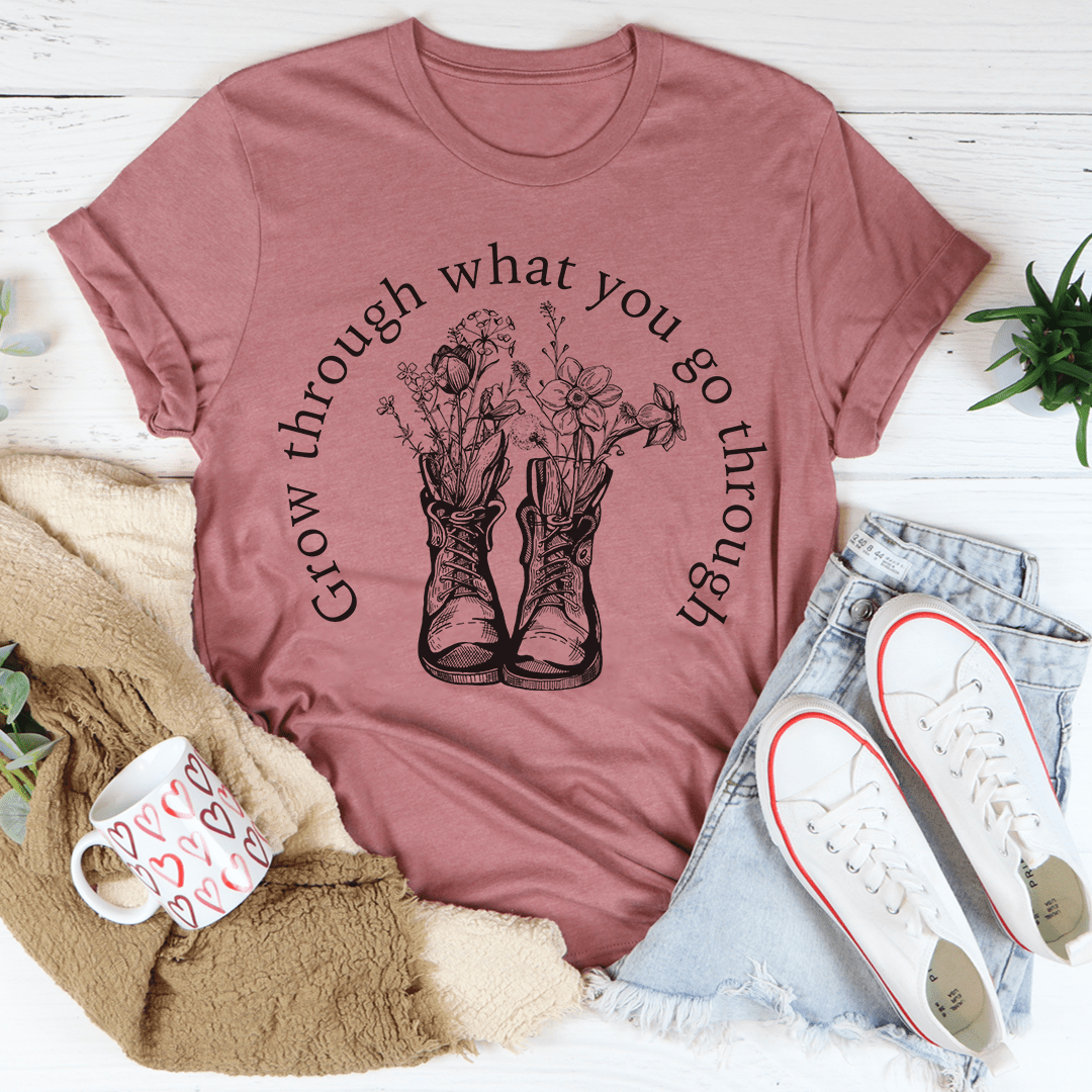 A stylish Grow Through What You Go Through Boots Tee made of soft ring-spun cotton, featuring double stitching for durability.