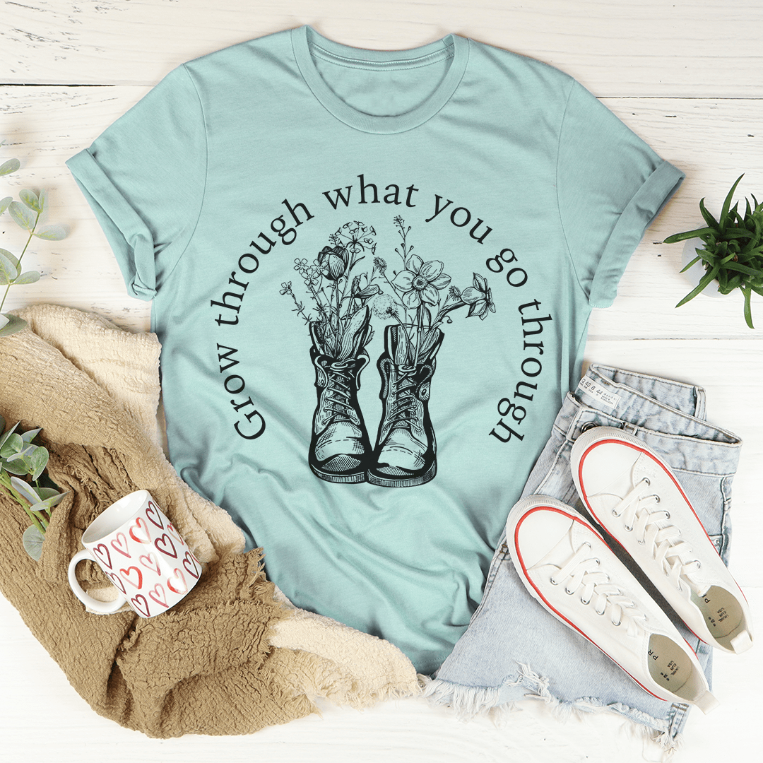 A stylish Grow Through What You Go Through Boots Tee made of soft ring-spun cotton, featuring double stitching for durability.