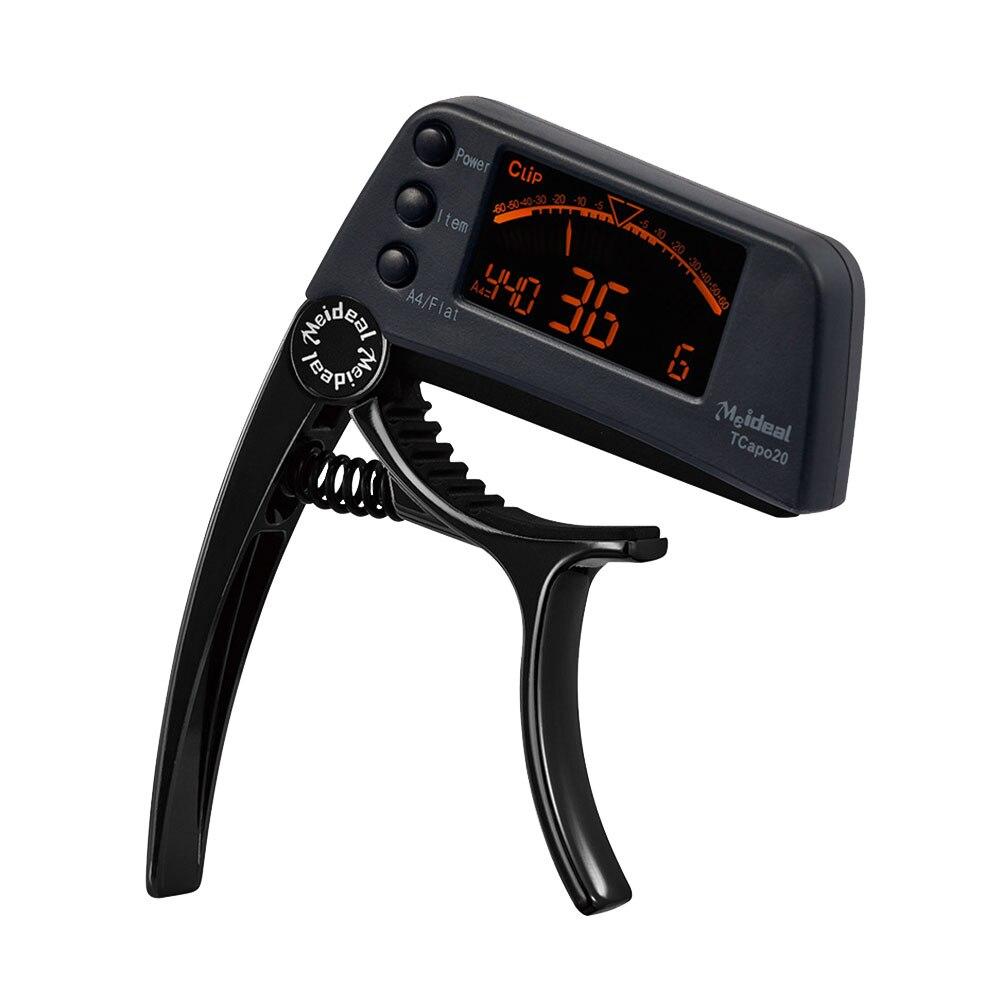 Guitar Tuner Capo 2 in 1, a compact device for tuning and capo functionality, suitable for guitar, bass, and violin.