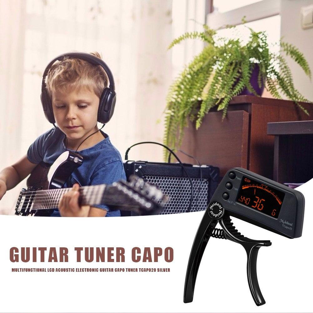 Guitar Tuner Capo 2 in 1, a compact device for tuning and capo functionality, suitable for guitar, bass, and violin.