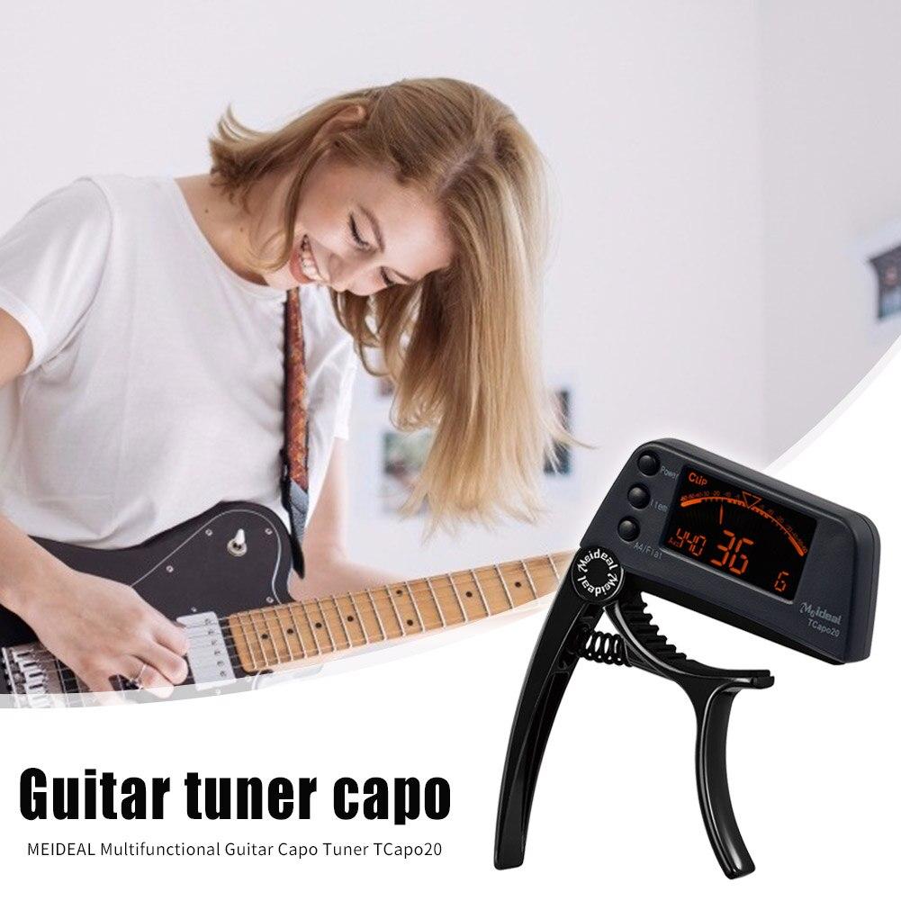 Guitar Tuner Capo 2 in 1, a compact device for tuning and capo functionality, suitable for guitar, bass, and violin.