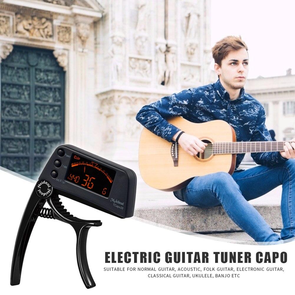 Guitar Tuner Capo 2 in 1, a compact device for tuning and capo functionality, suitable for guitar, bass, and violin.