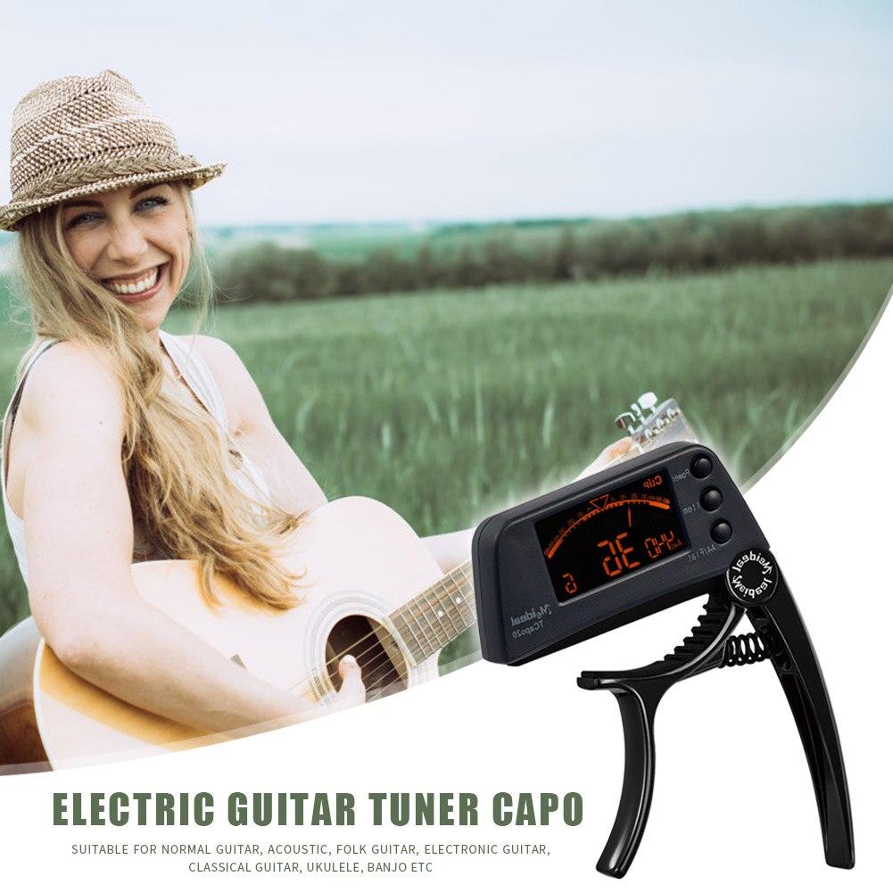 Guitar Tuner Capo 2 in 1, a compact device for tuning and capo functionality, suitable for guitar, bass, and violin.