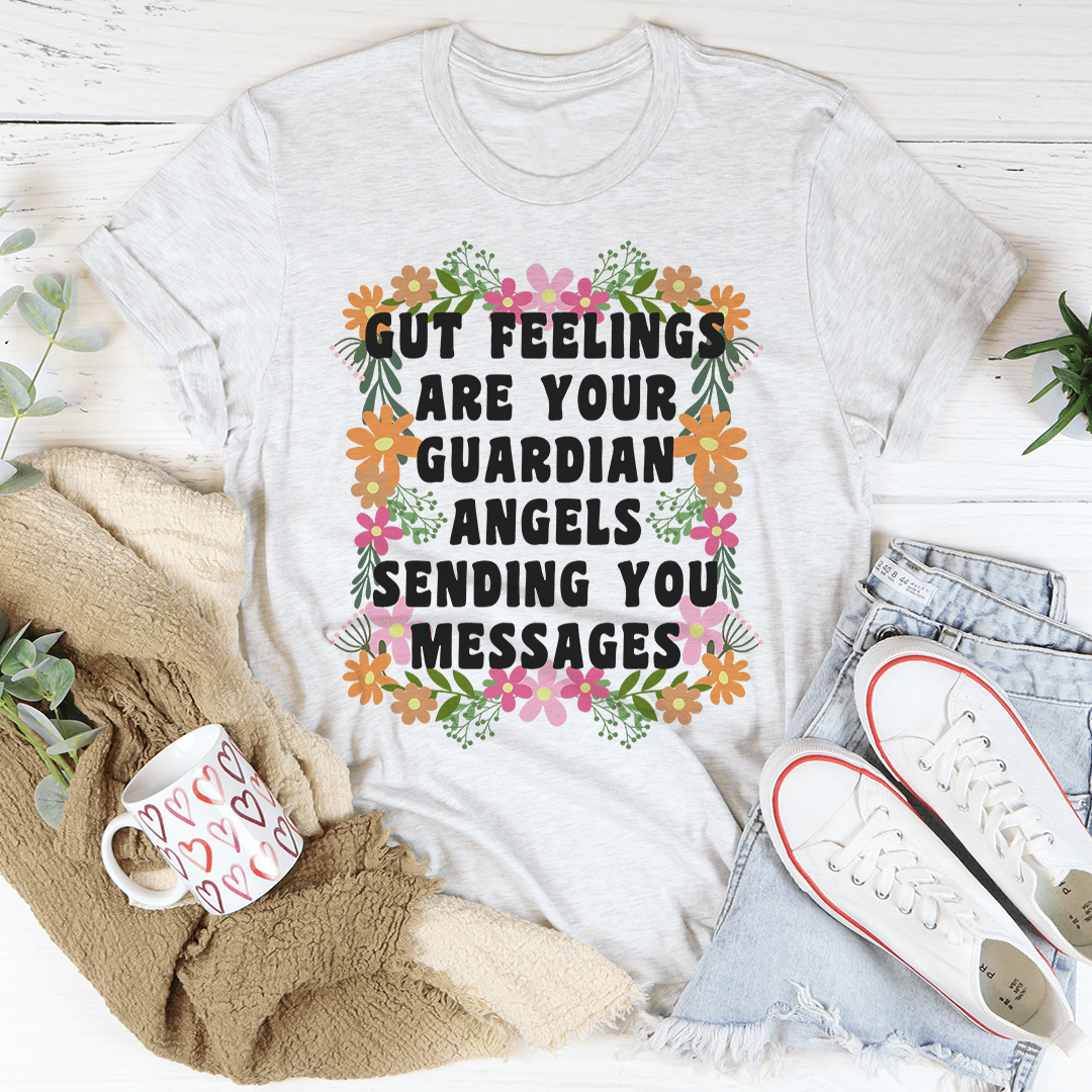 Gut Feelings Are Your Guardian Angels Tee in soft cotton, featuring double stitching and a unique inspirational print.