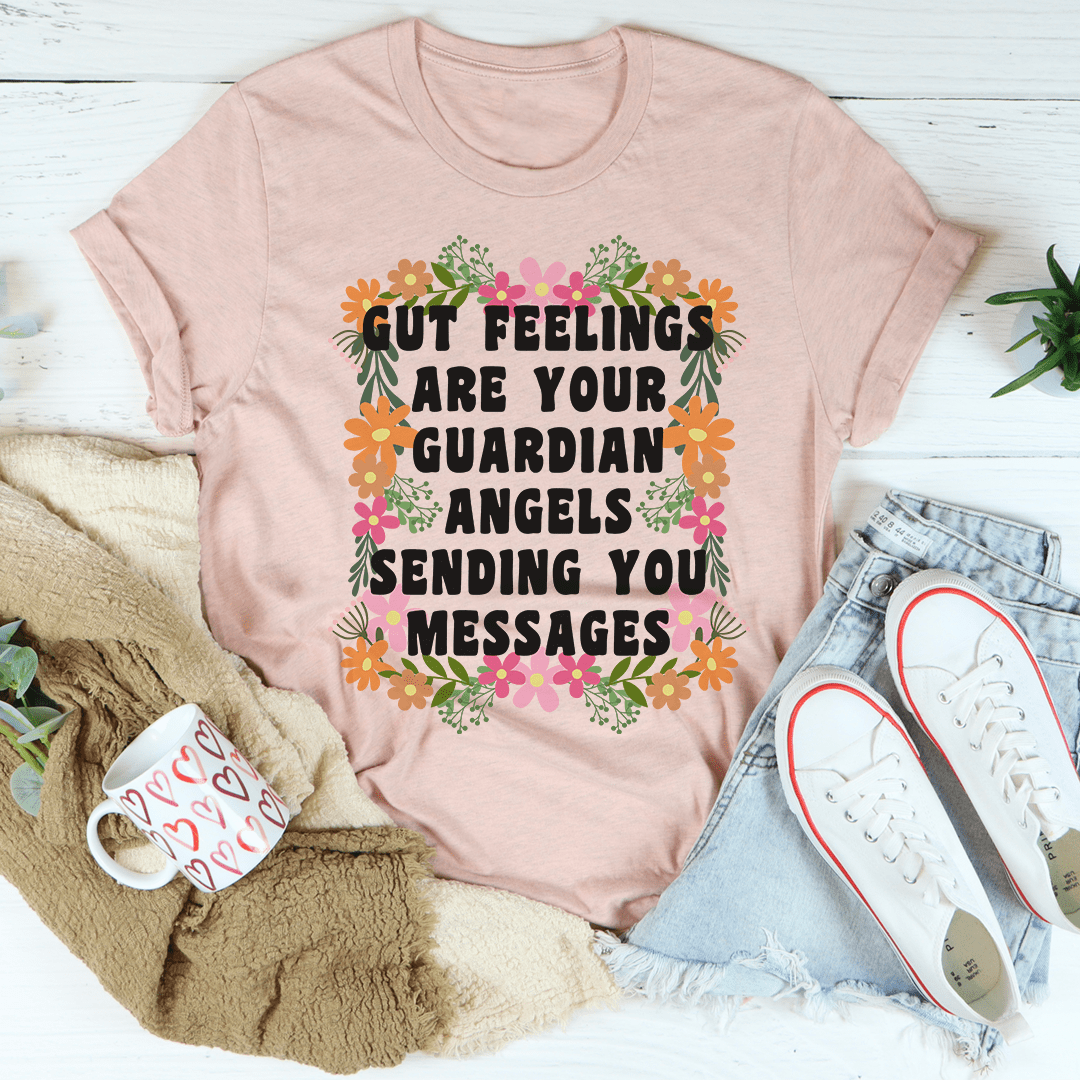 Gut Feelings Are Your Guardian Angels Tee in soft cotton, featuring double stitching and a unique inspirational print.