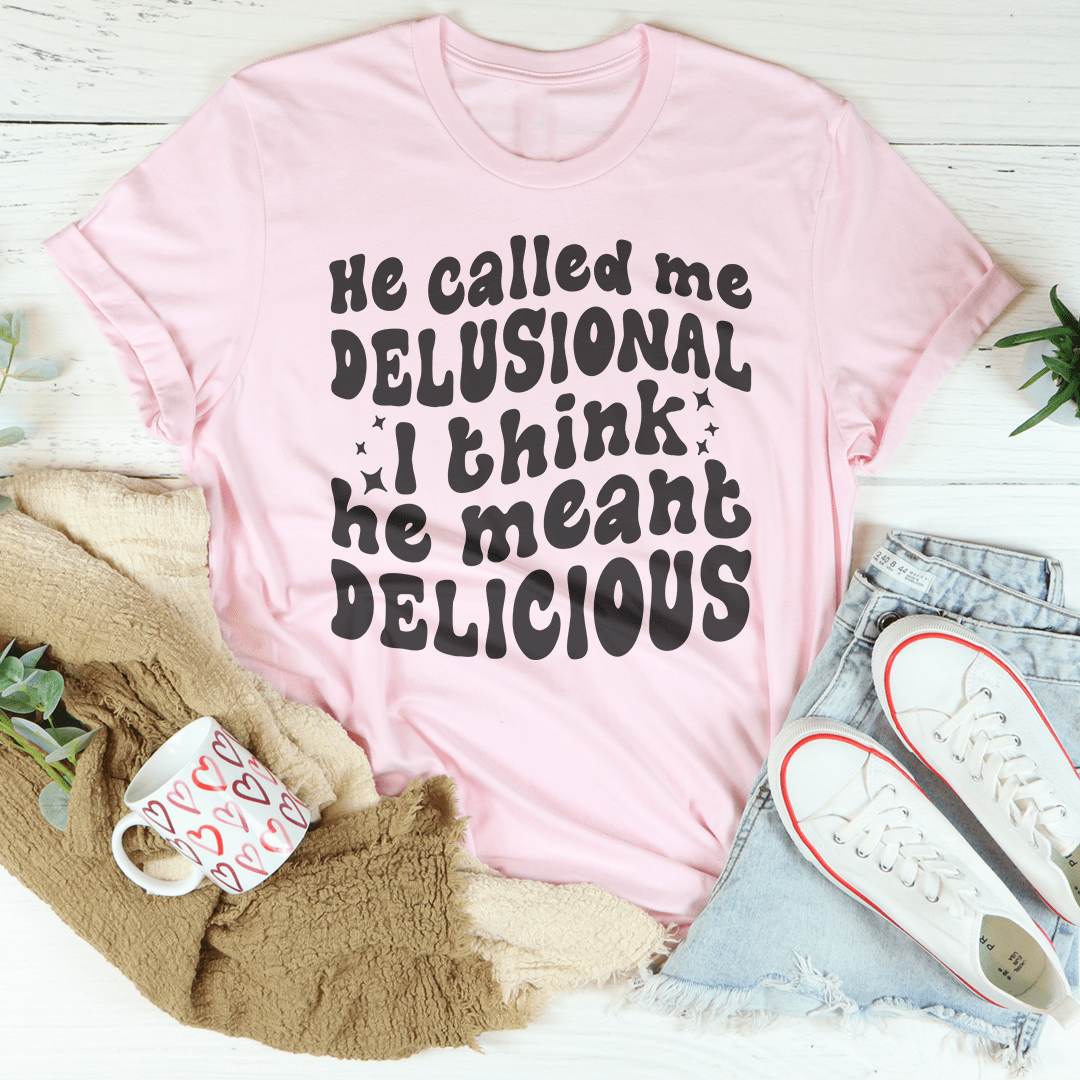 He Called Me Delusional I Think He Meant Delicious t-shirt displayed on a mannequin, showcasing its soft fabric and durable stitching.