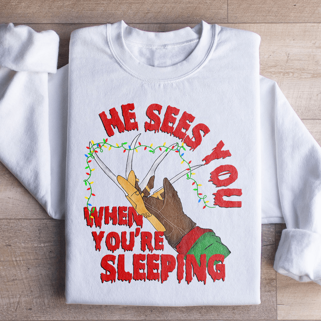 Cozy 'He Sees You When You're Sleeping' sweats featuring a unique design by top artists, made from soft cotton/poly fleece blend.