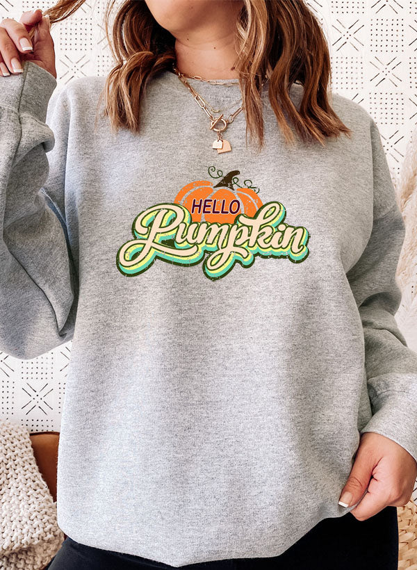 Hello Pumpkin Sweat Shirt featuring a cozy fleece lining and adjustable cuffs, perfect for autumn wear.