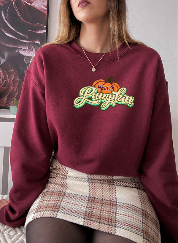 Hello Pumpkin Sweat Shirt featuring a cozy fleece lining and adjustable cuffs, perfect for autumn wear.